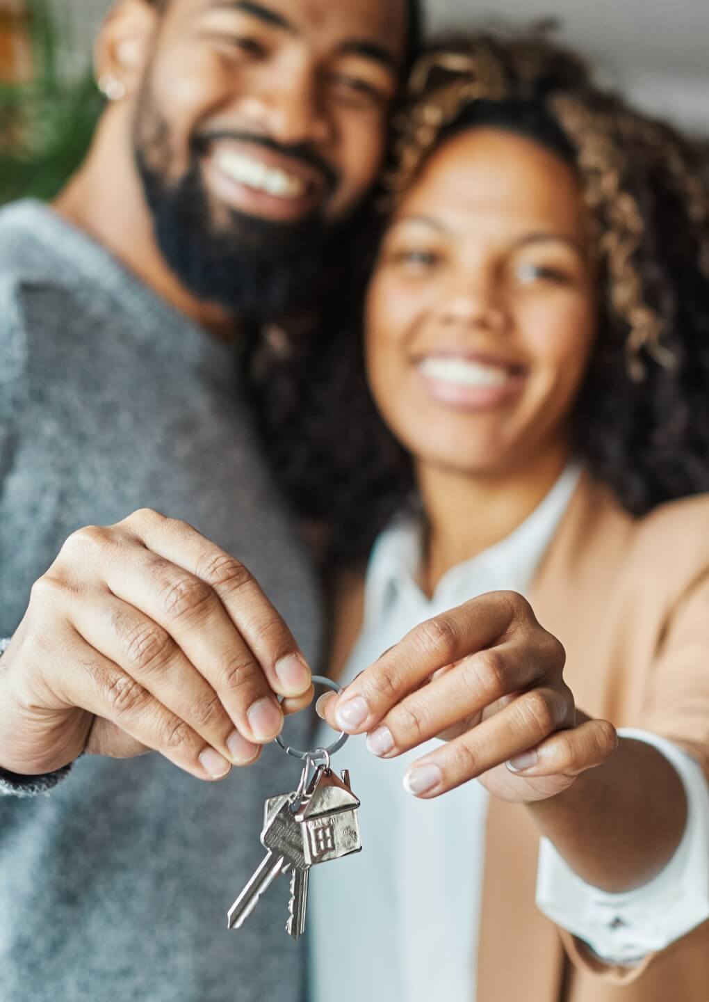 homebuyers a couple holding house keys